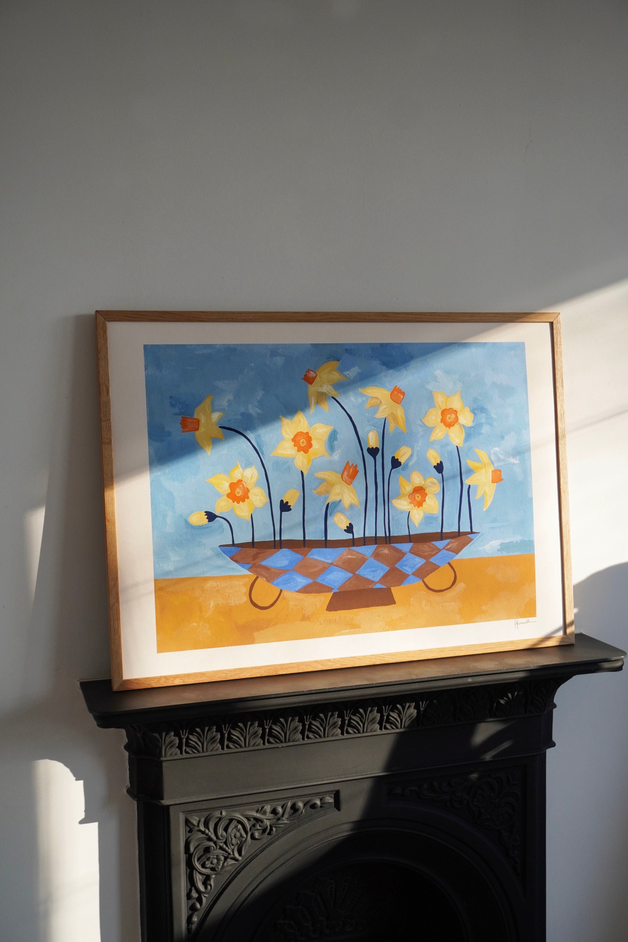daffodils in checkered vase