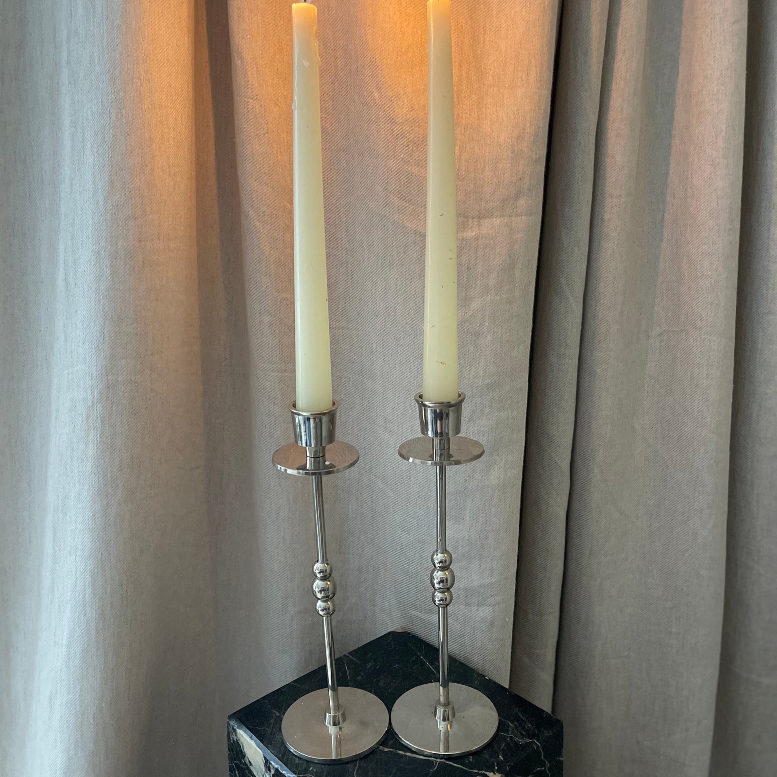 A Pair of Chrome Plated Candlesticks with Beads