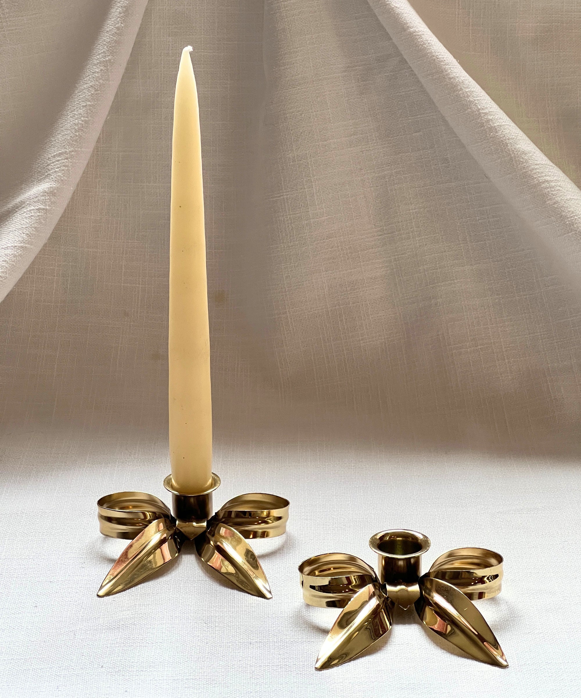 A Pair of Bow Candleholders | Brass