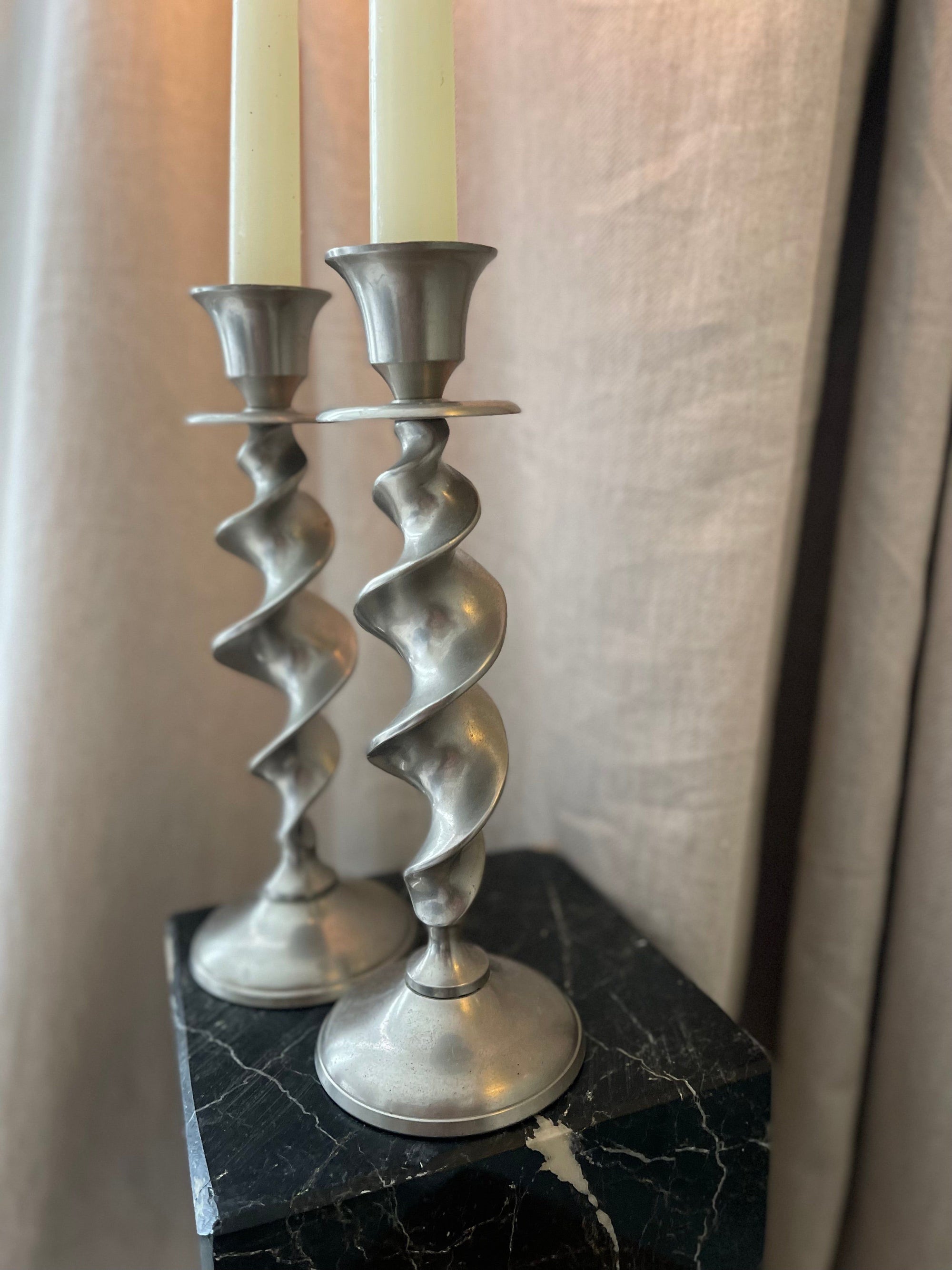 A Pair of Twisted Silvertone Candlesticks
