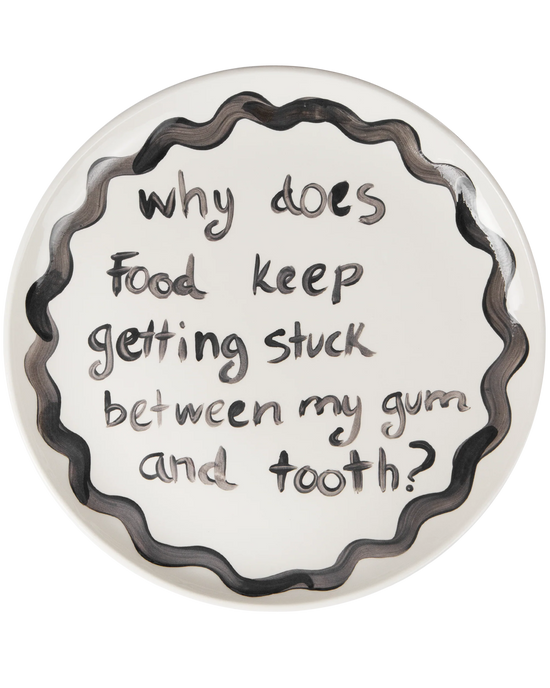 "Why Does Food Keep Getting Stuck Between My Gum and tooth" Plate