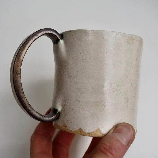 Cream ceramic muCream Ceramic Mug with a Scalloped Lower Edge and Gold Handle