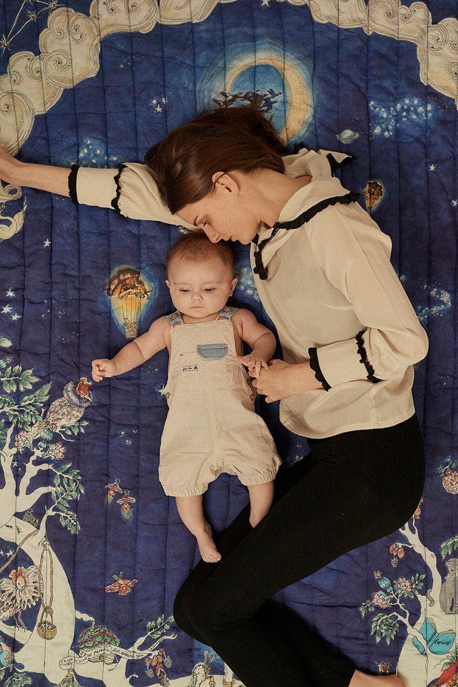 The Space Above the Ground Quilted Blanket