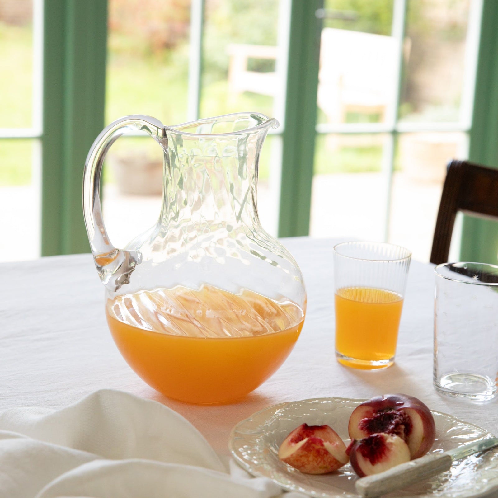 A Large Crystal Water Jug with Ripple Design