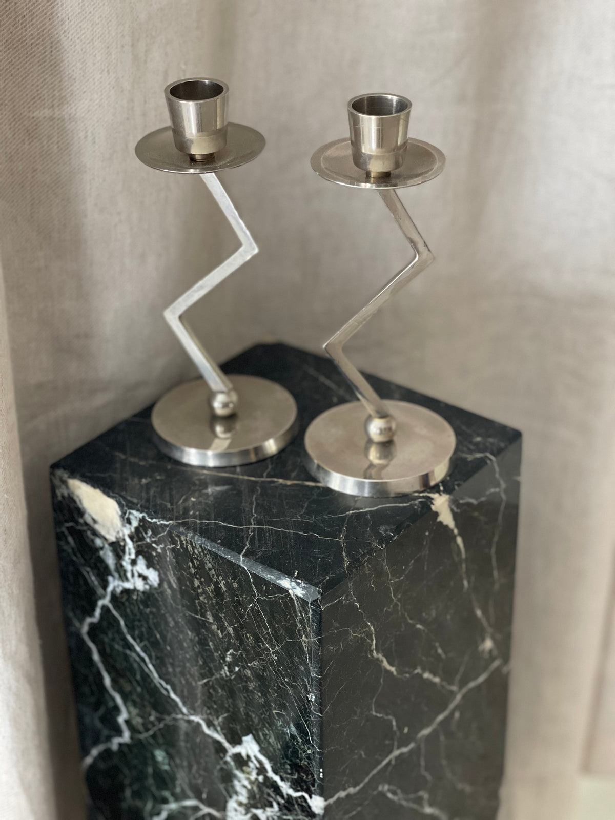 A Pair of Chrome Memphis Zig Zag Candlesticks