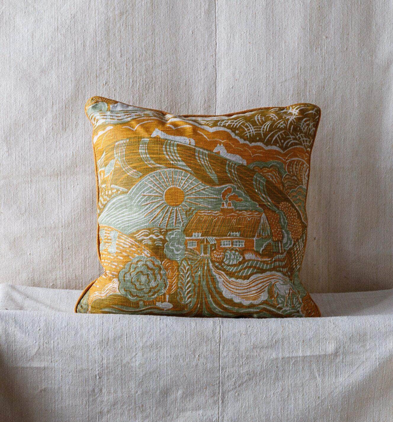 The Plough Small Piped Cushion in Harvest Gold and Corn Grey