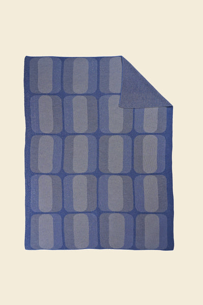 grey/blue geometric knit blanket with flipped corner in merino wool and organic cotton