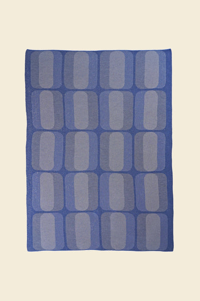 laid flat grey/blue geometric knit blanket in merino wool and organic cotton
