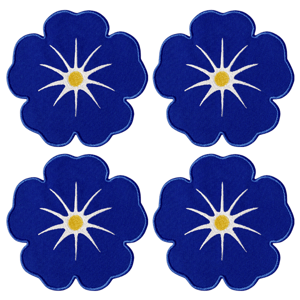 Octaevo Morning Glory Coasters (set of 4) feature blue florals with star centers and yellow dots on linen-cotton blend.