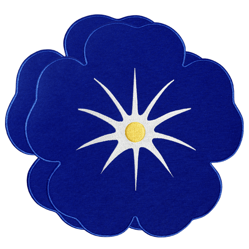 Octaevo’s Morning Glory Placemats (Set of 2): blue flower with white starburst, great for embroidered table decor.