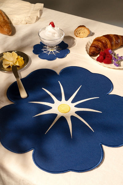 Octaevo Morning Glory Placemats (Set of 2) on a breakfast table with croissant, butter, raspberries, and dessert.
