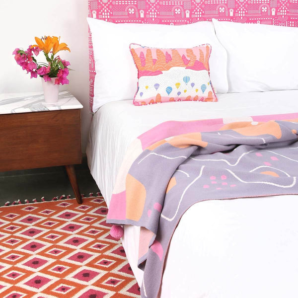 Bedroom with Orange Evil Eye Flatweave Wool Rug