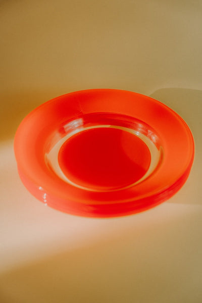Four Orange Glass Plates