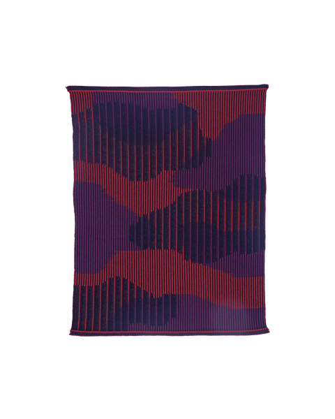 top view of red knit organic cotton table mat with abstract design