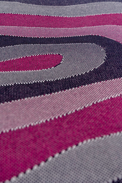detail of organic cotton knit tablecloth with curved edges in purple and navy