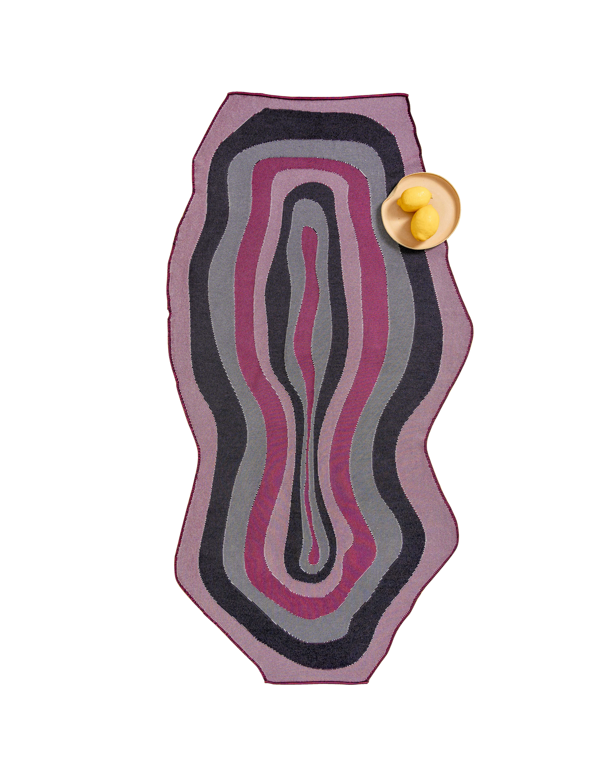 top view of organic cotton knit tablecloth with curved edges in purple and navy