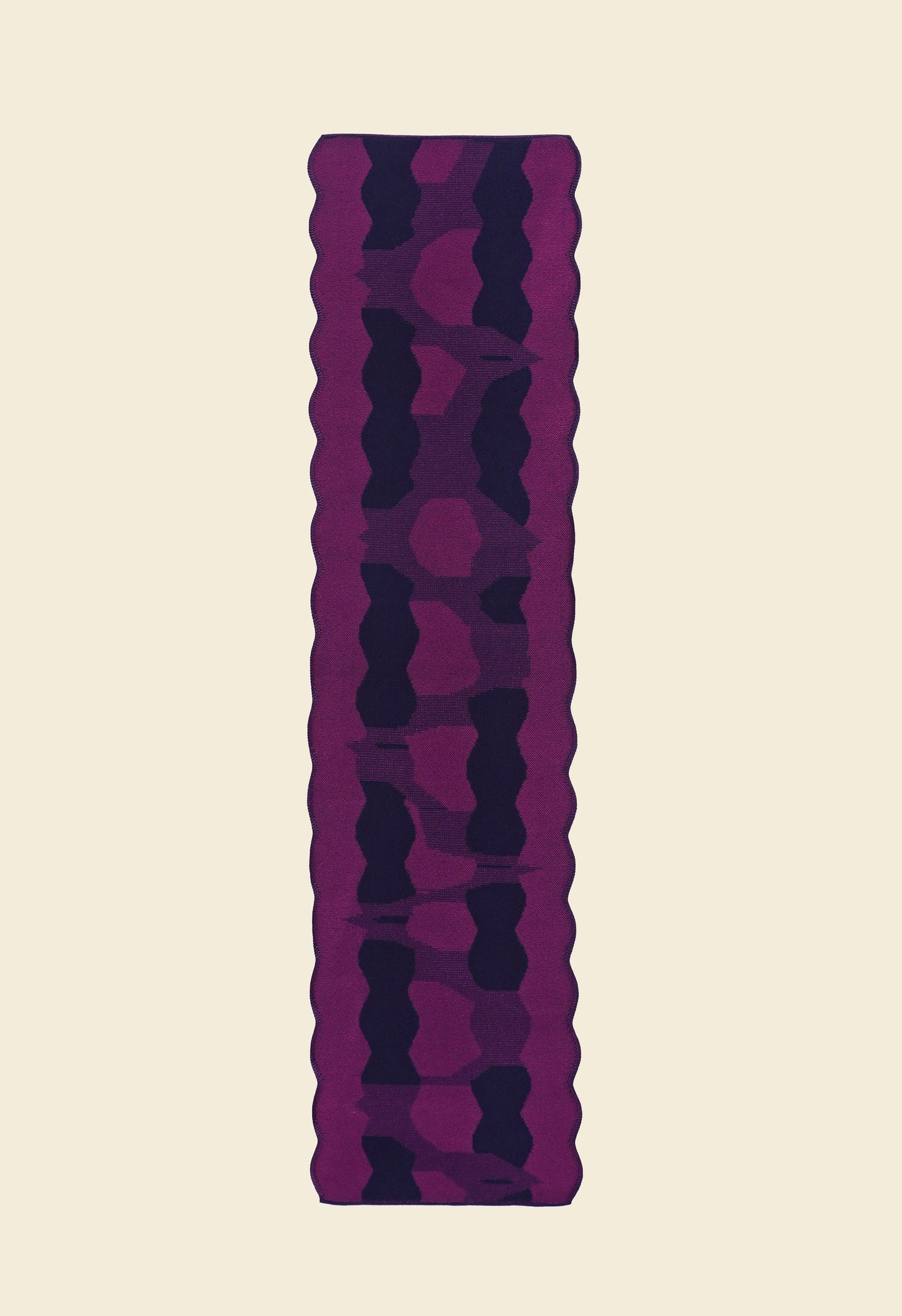 back side top view of purple knit organic cotton and viscose table runner with abstract pattern and wavy edges