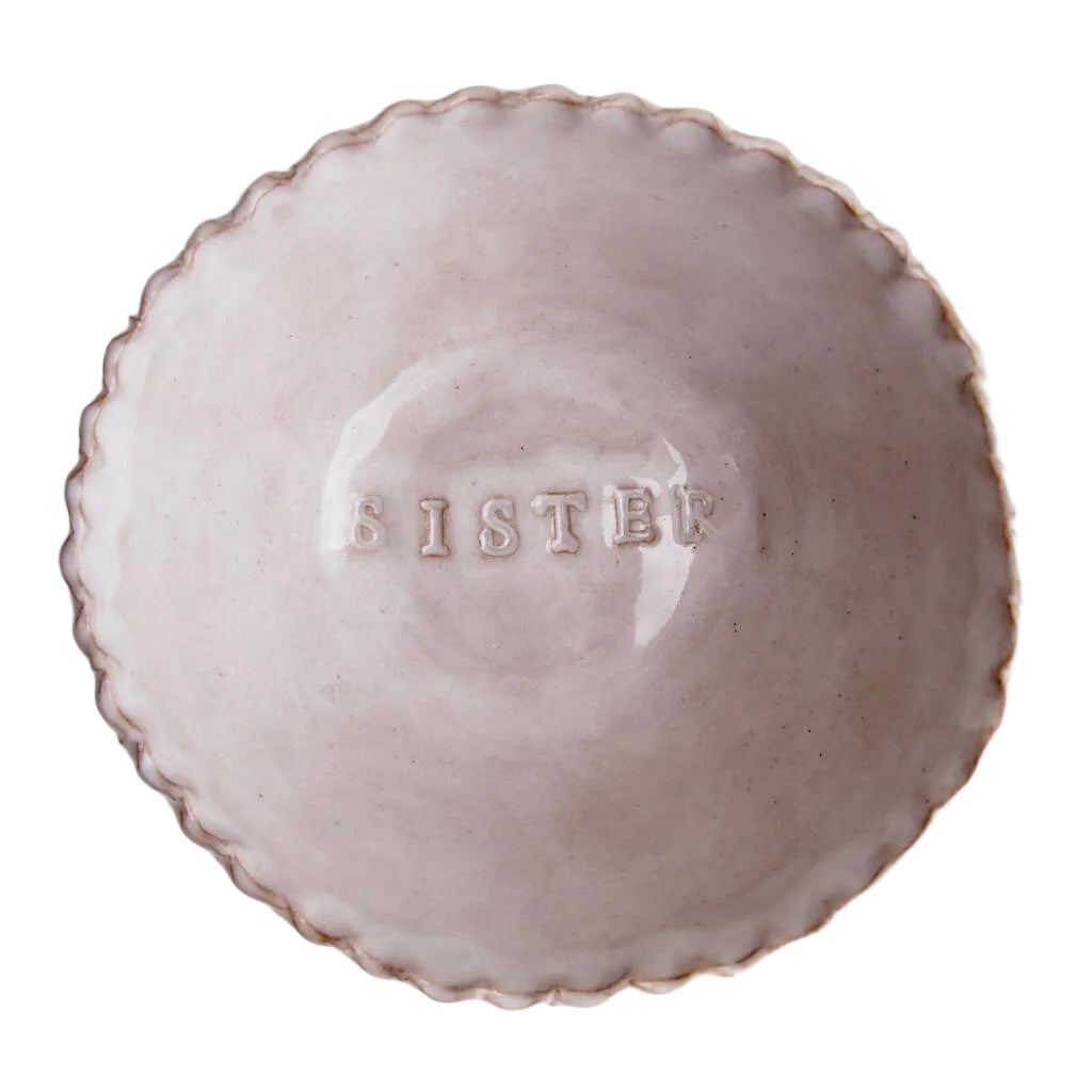 Ceramic bowl with 'SISTER' engraved on a white background