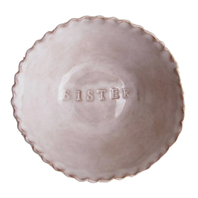 Ceramic bowl with 'SISTER' engraved on a white background