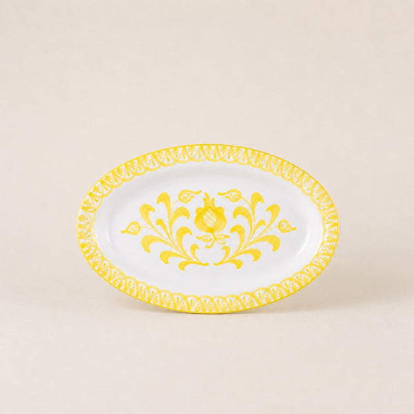 Decorative plate with yellow floral design on a beige background