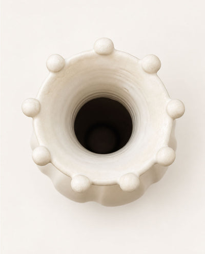 Overhead view of the Pearl sculptural ceramic vase showing its circular opening, flared rim and rounded decorative details.