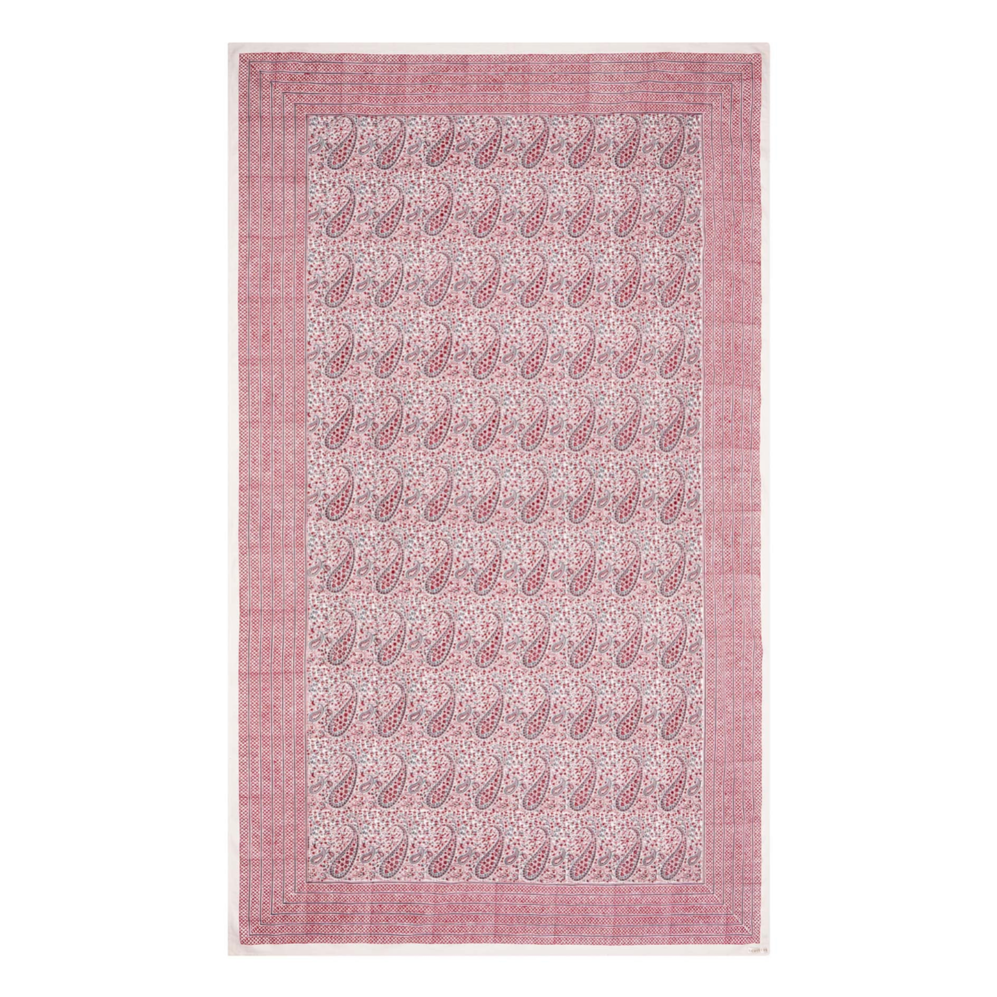 Pink block printed tablecloth with paisley pattern on a white background