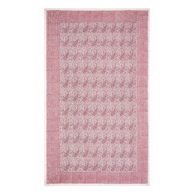 Pink block printed tablecloth with paisley pattern on a white background