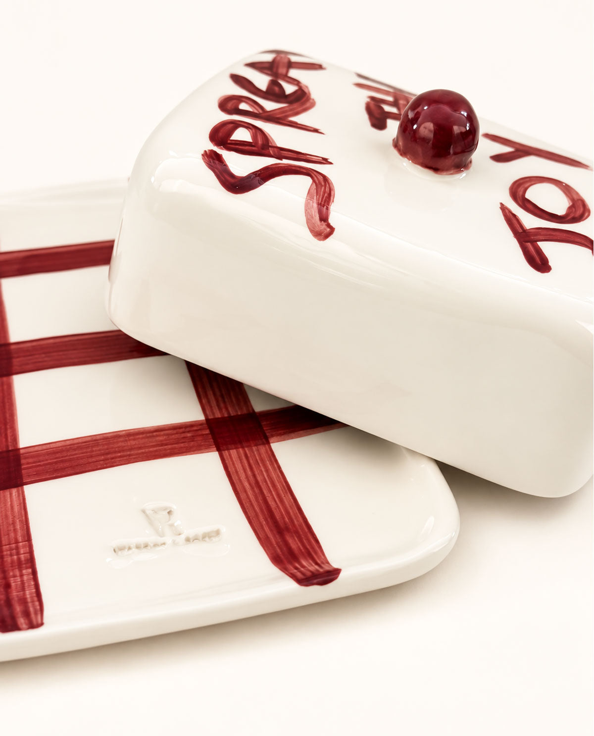 POMONA handmade butter dish featuring burgundy brushstrokes, crafted in Greece
