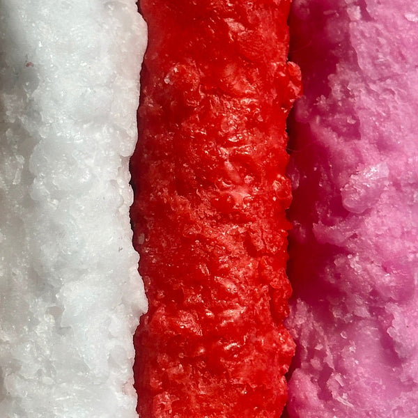 Close-up of textured red, white, and pink materials