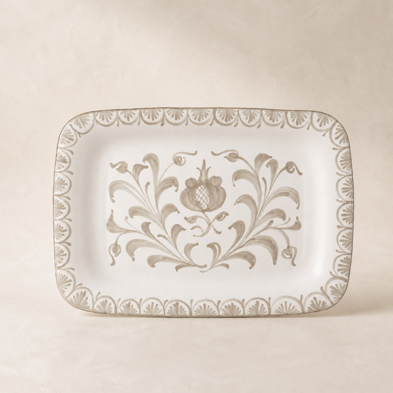 Decorative rectangular plate with floral patterns on a beige background