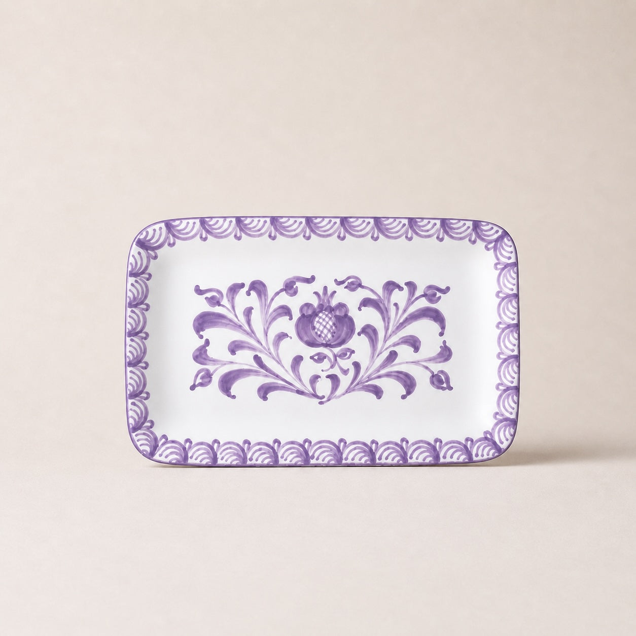Rectangular plate with purple floral design on a beige background