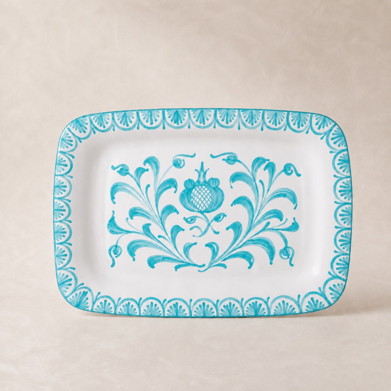 Rectangular plate with blue floral design on a beige background