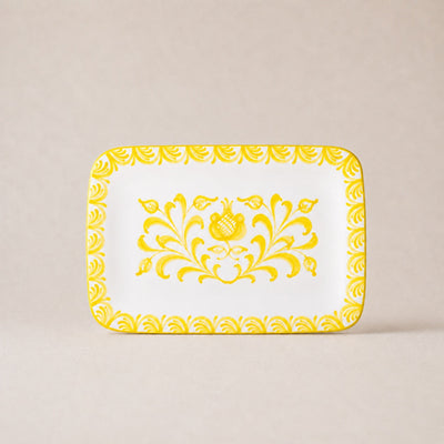 Decorative tray with yellow floral pattern on a beige background