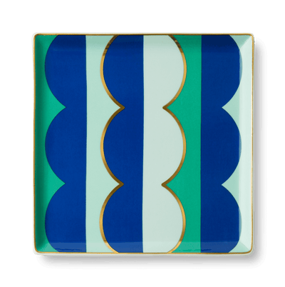 The OCTAEVO Riviera Wave Ceramic Tray features bold blue, green, and gold patterns—perfect for a stylish tablescape.