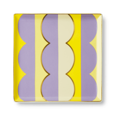 The OCTAEVO Riviera Wave Ceramic Tray features bold yellow, purple, and cream stripes to elevate your tablescape.