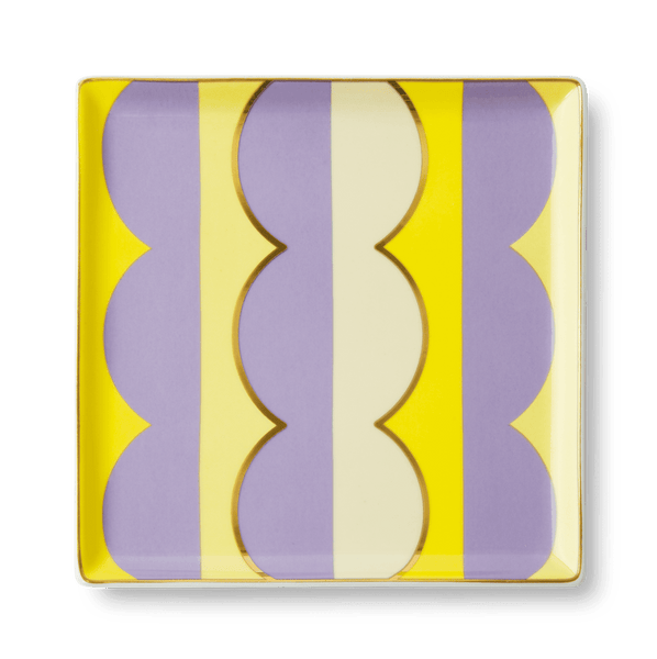 The OCTAEVO Riviera Wave Ceramic Tray features bold yellow, purple, and cream stripes to elevate your tablescape.