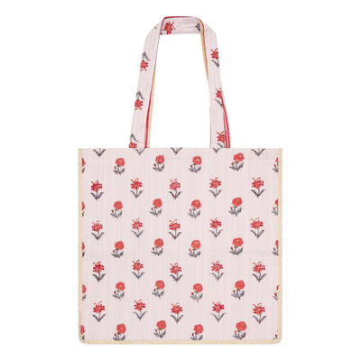 A block printed cotton tote bag with contrast trim with a floral design
