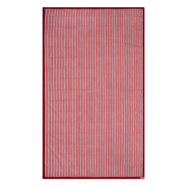 Red and white striped block printed tablecloth on a white background