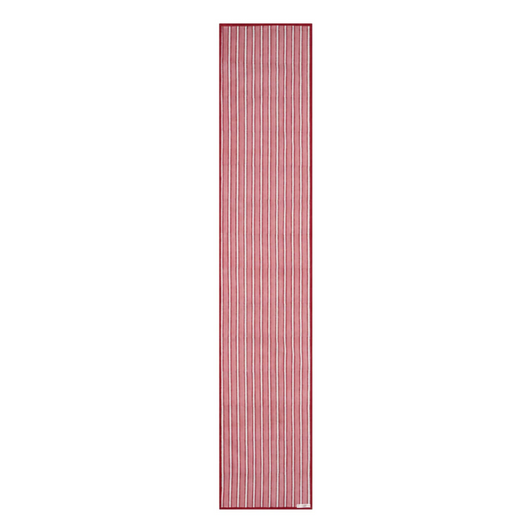 A striped cotton table runner with a classic design, predominantly in red and white colors, displayed on a table.