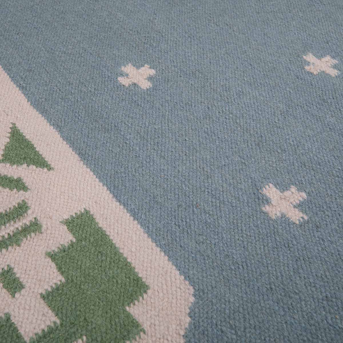 Detail of blue and green manali flatweave wool rug