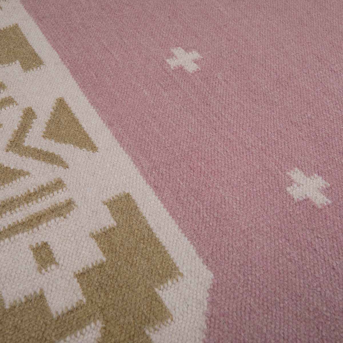Detail of rose pink and ochre yellow manali flatweave rug handwoven in wool