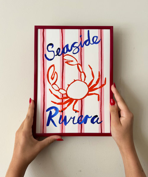 Seaside Riviera print, crab illustration on striped background being held