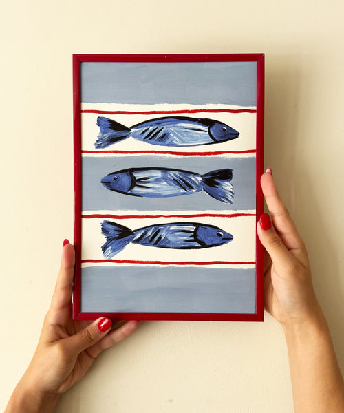 Seaside Fish print, three fish illustration on striped base being held