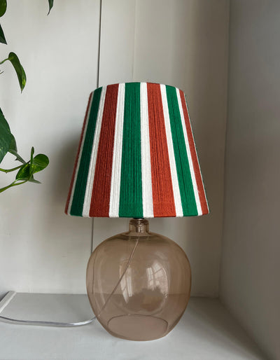 A Slice Shades handwoven yarn striped lampshade in Rust, Ecru & Jade Green on a white background.