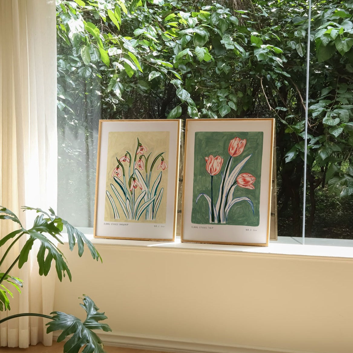 Snowdrop art print paired and styled next to our turquoise and pink tulip print.