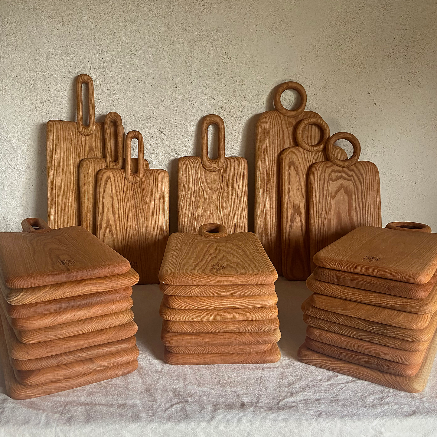 Set of wooden cutting boards and containers on a light background - lifestyle