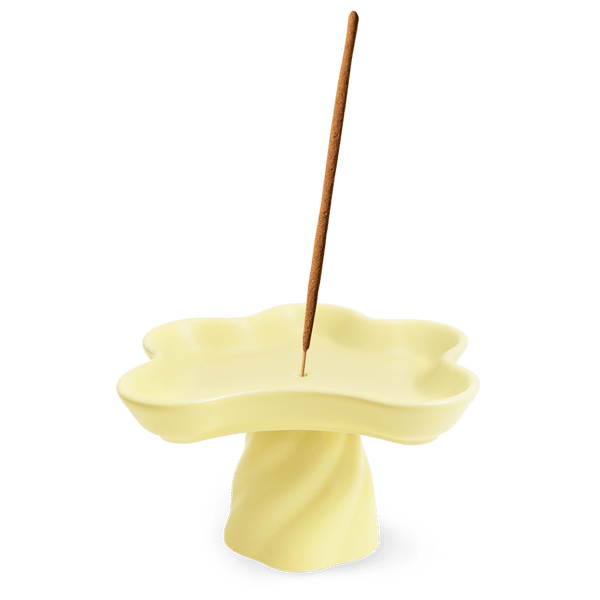 OCTAEVO Templo Incense Holder: handmade stoneware, pale yellow flower shape, holds an incense stick in the center.