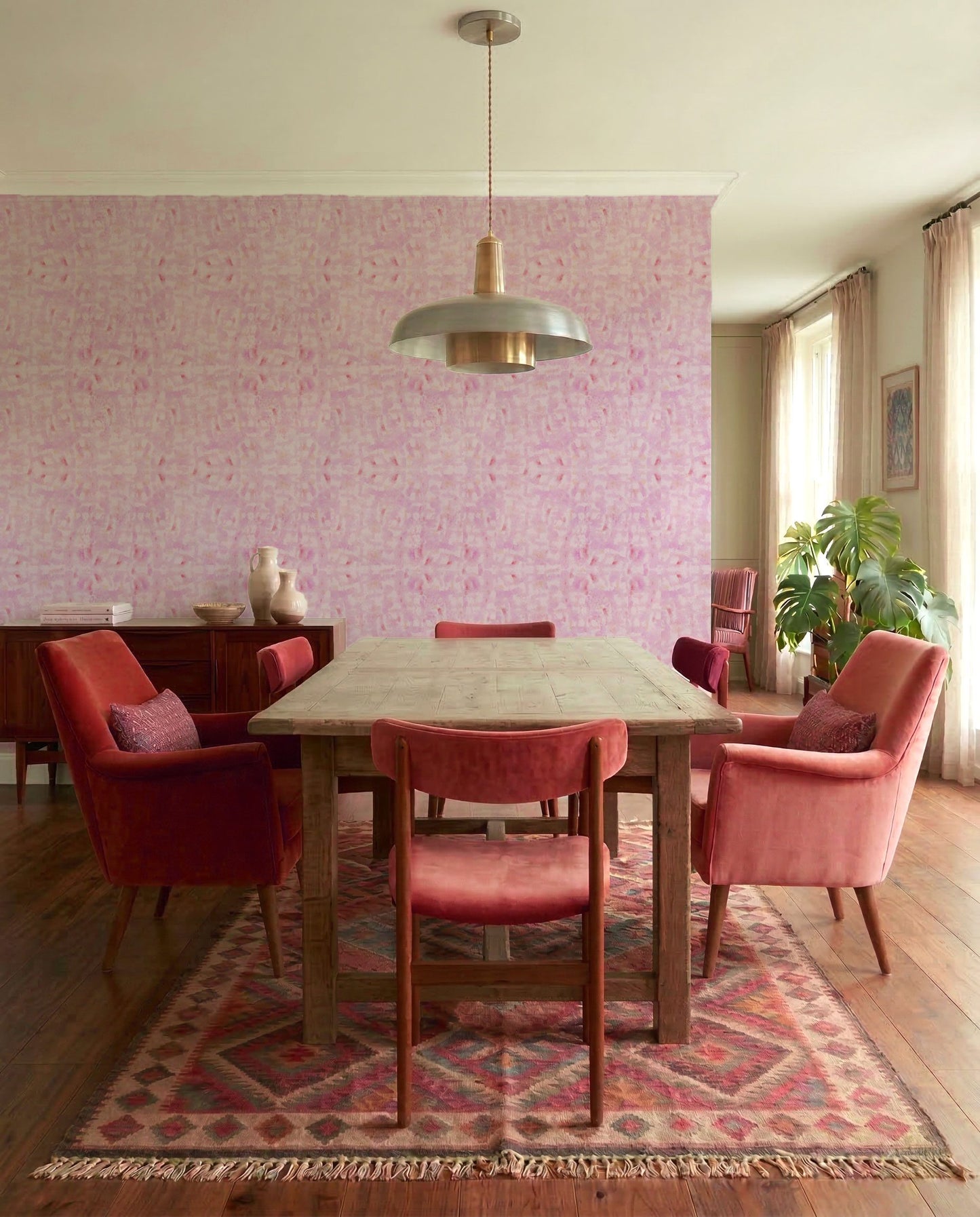 mid century dining room with pink watercolor abstract wallpaper
