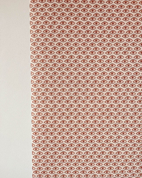 Brown evil eye wallpaper on wall in brown
