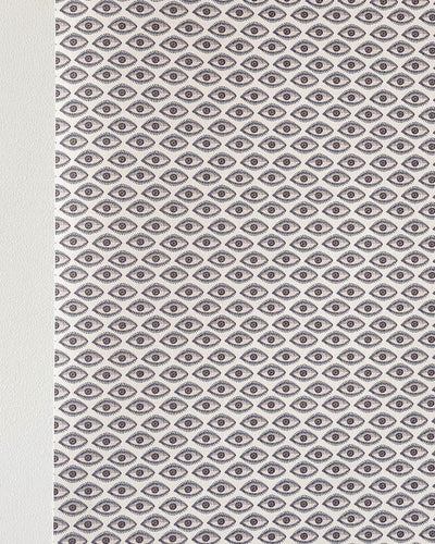 Evil eye wallpaper on wall in blue beige